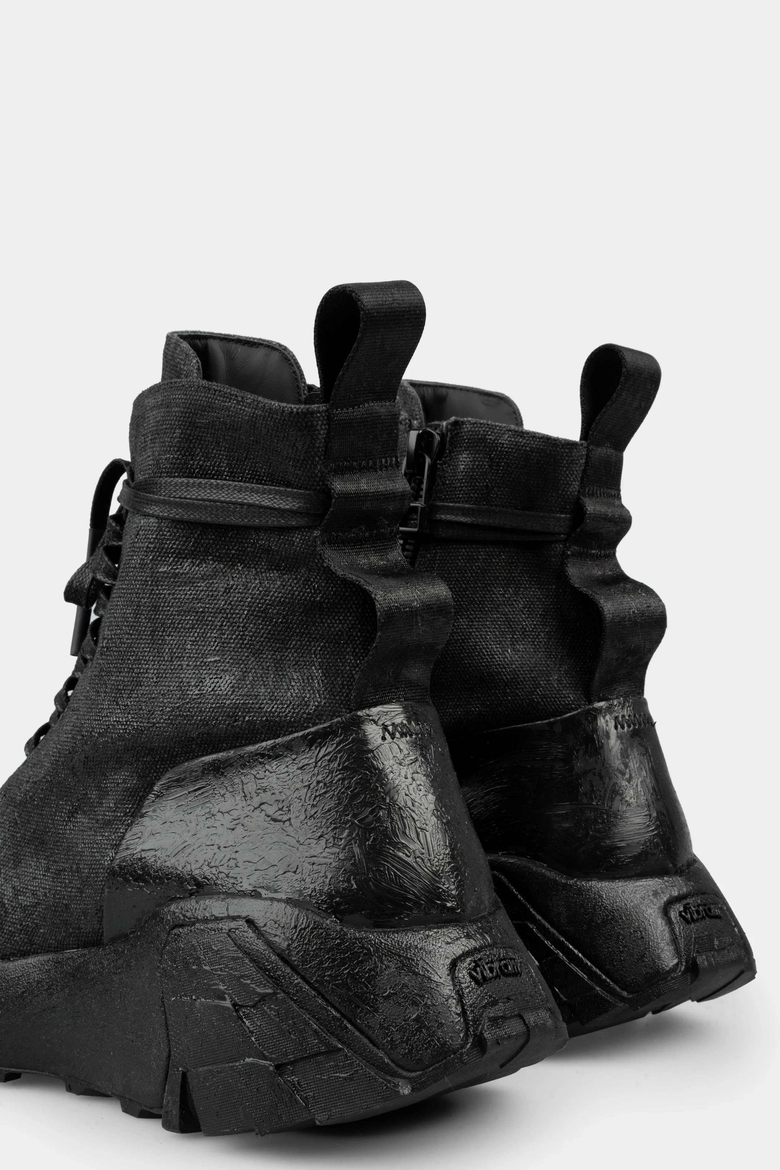 Tar coated canvas boots